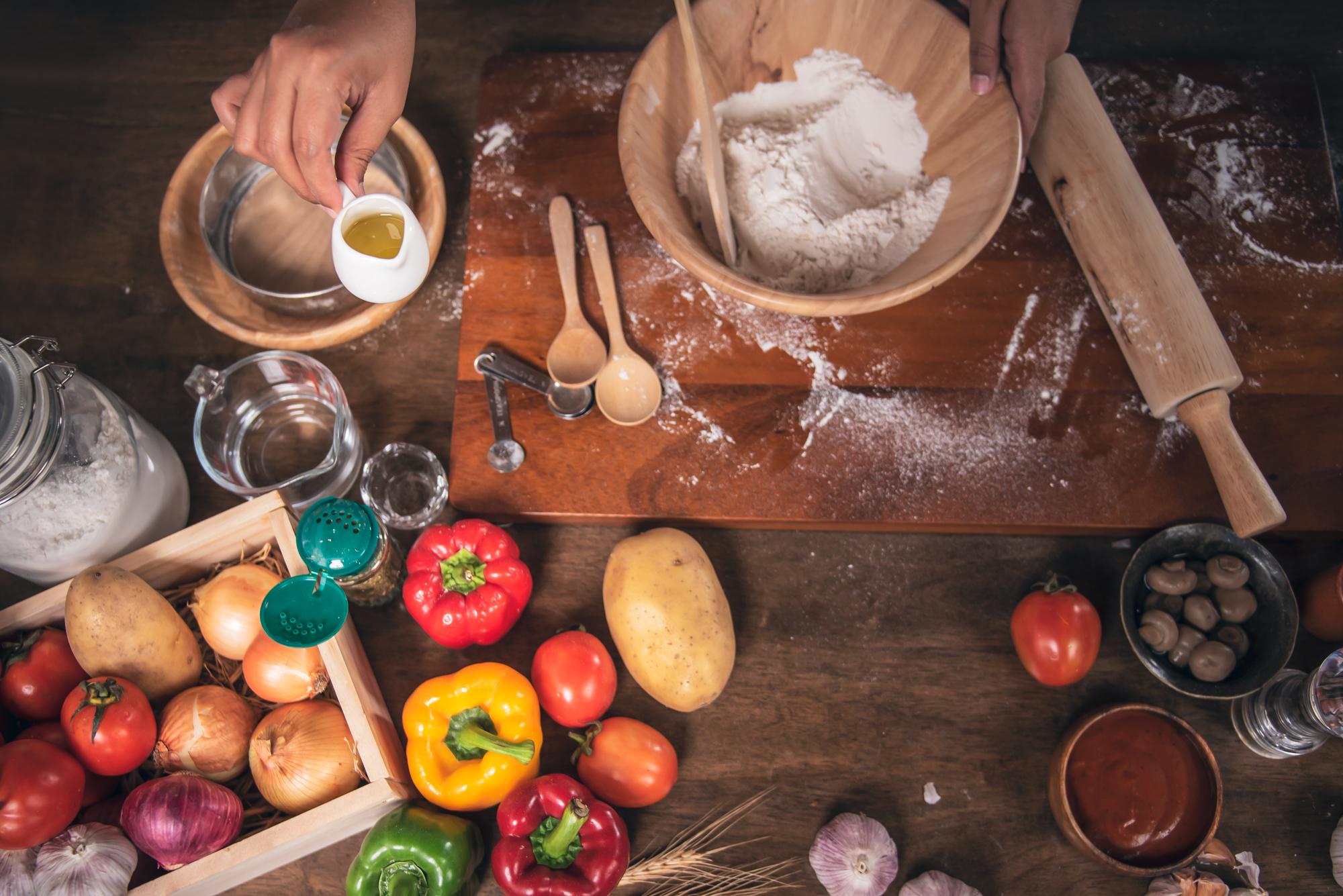Instructor preparing ingredients on wooden table